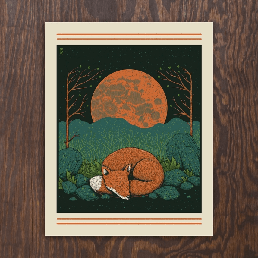 Screenprint of a fox sleeping in front of a full moon shown on a woodgrain background