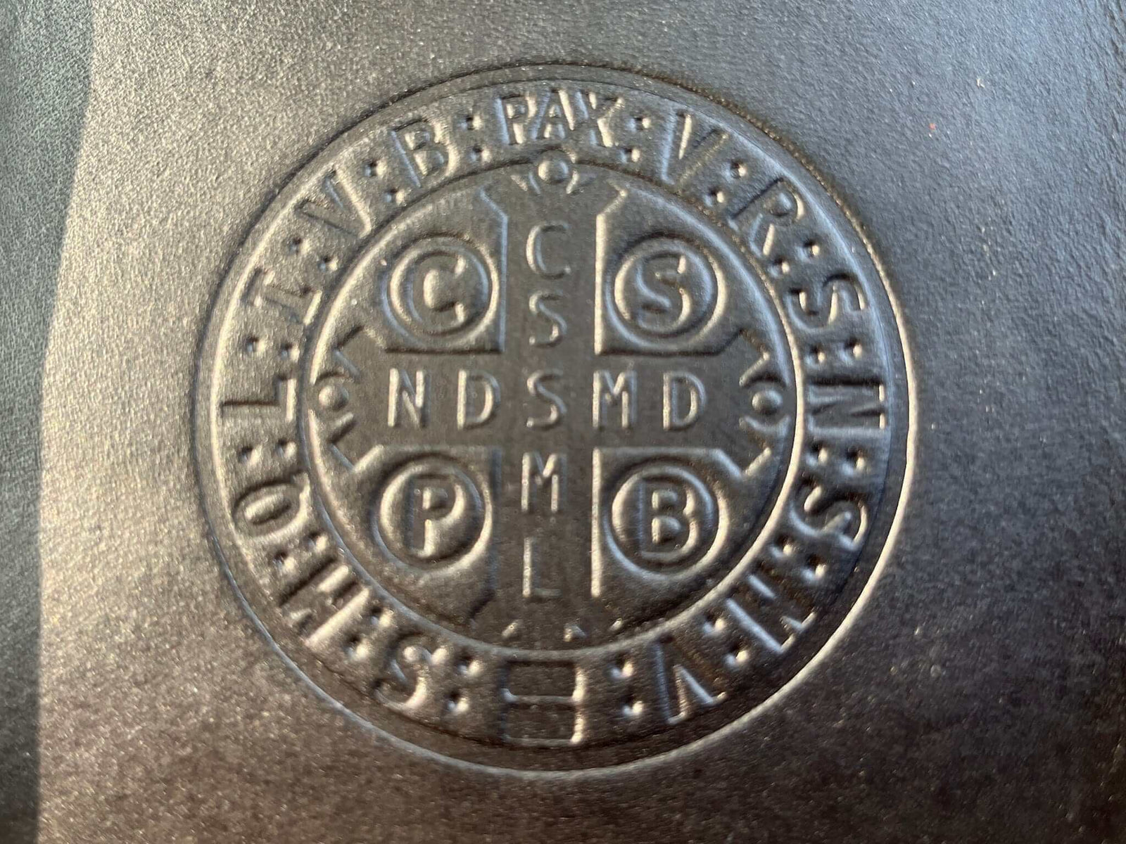 Detail of Black leather tray with Saint Benedict medal image