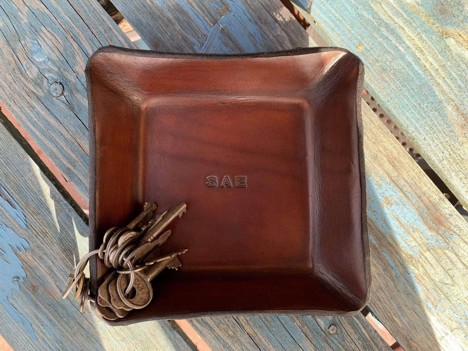 Monogrammed valet tray. Dark brown.