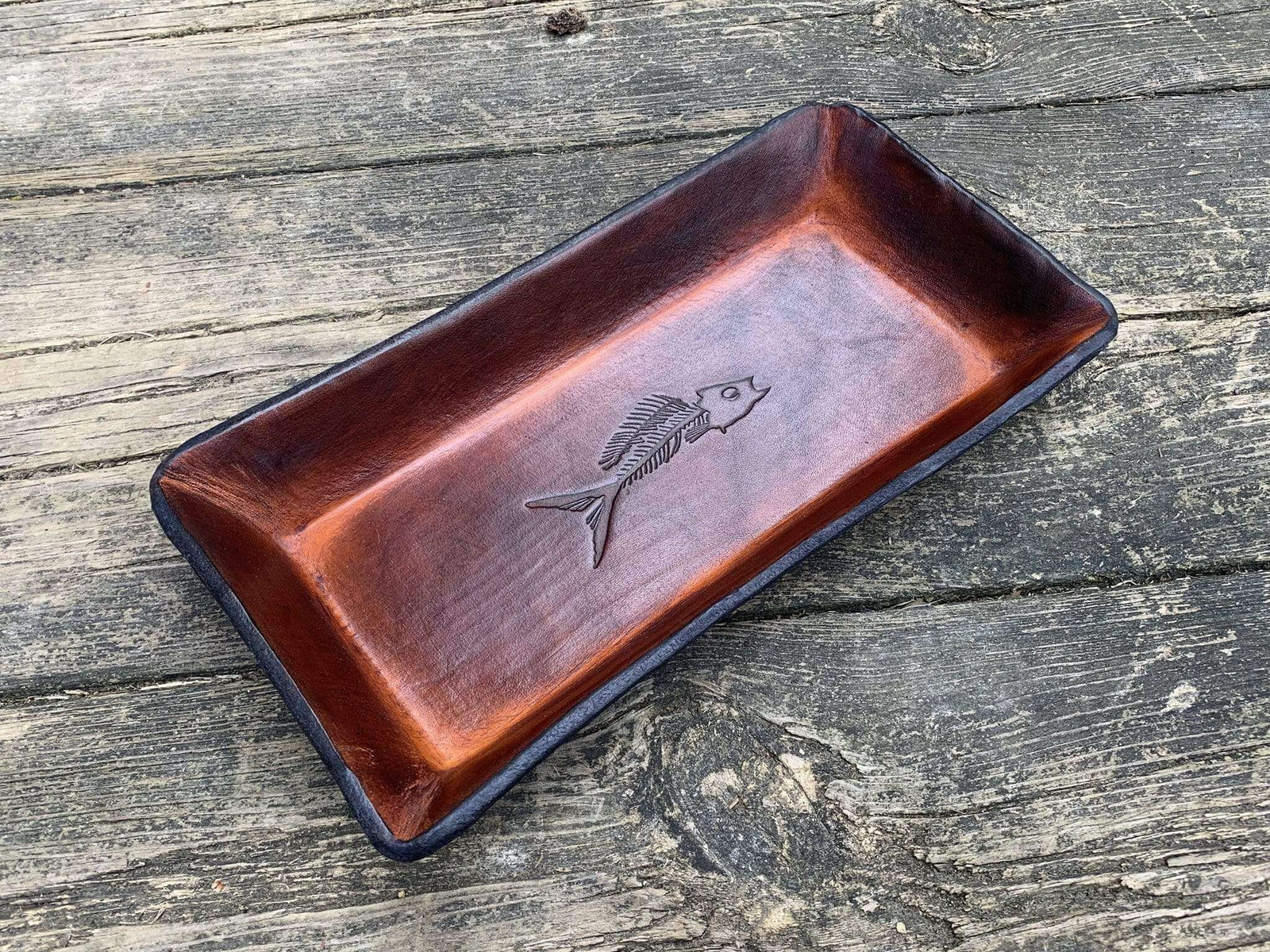 Timber brown leather valet tray with fossil fish image.