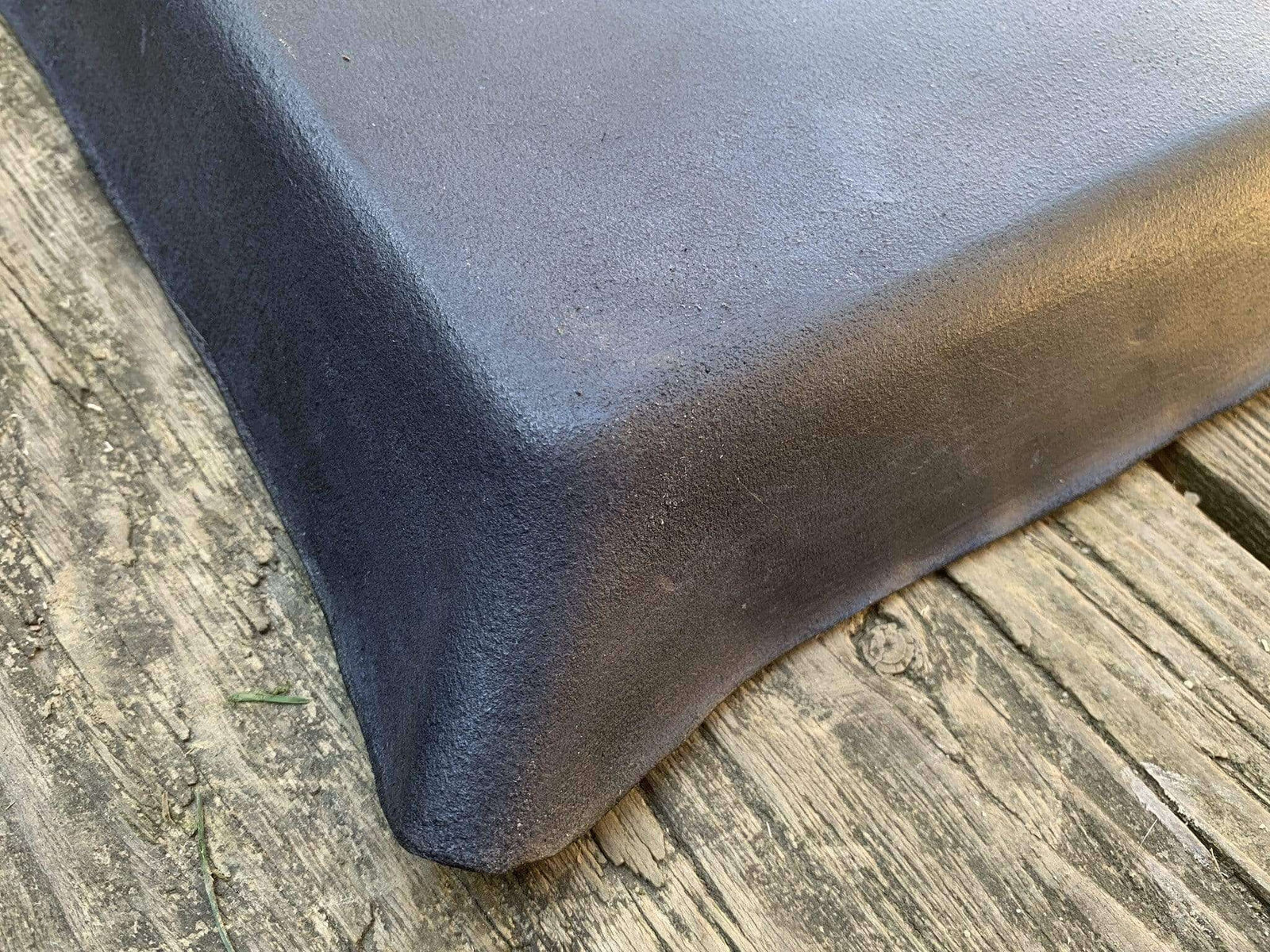 Underside detail of leather pipe tray.