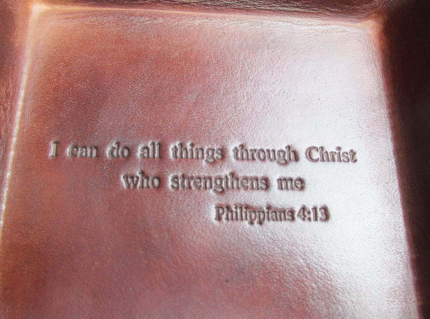 Leather tray with bible verse. Philippians. Detail.