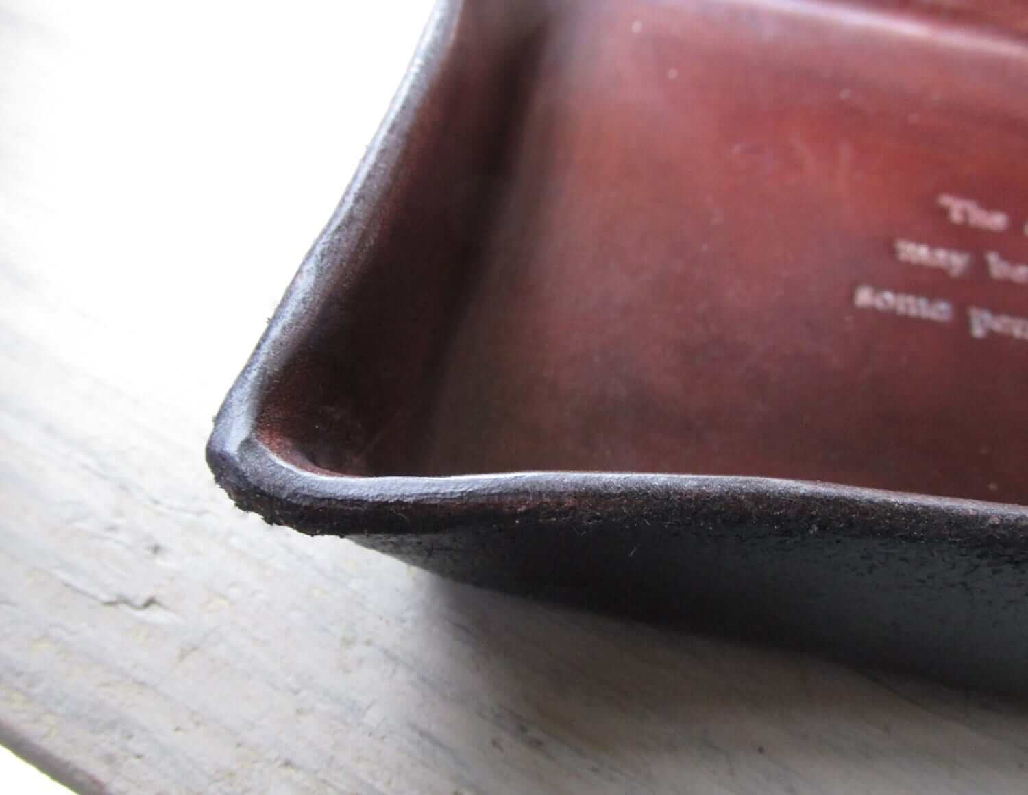 St Francis quotation leather desk tray. Detail.