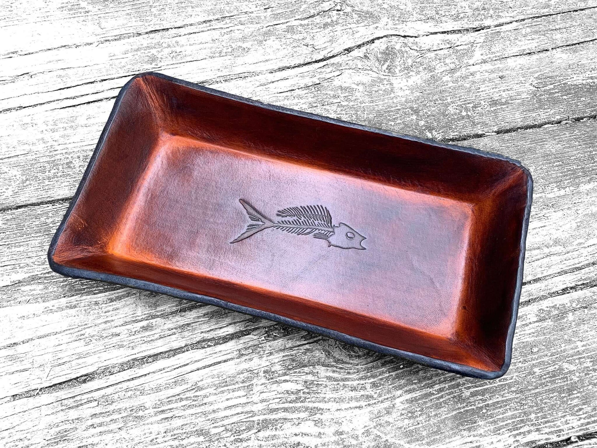 Our Leather Valet with Fossil Fish Motif Makes a Rustic Statement