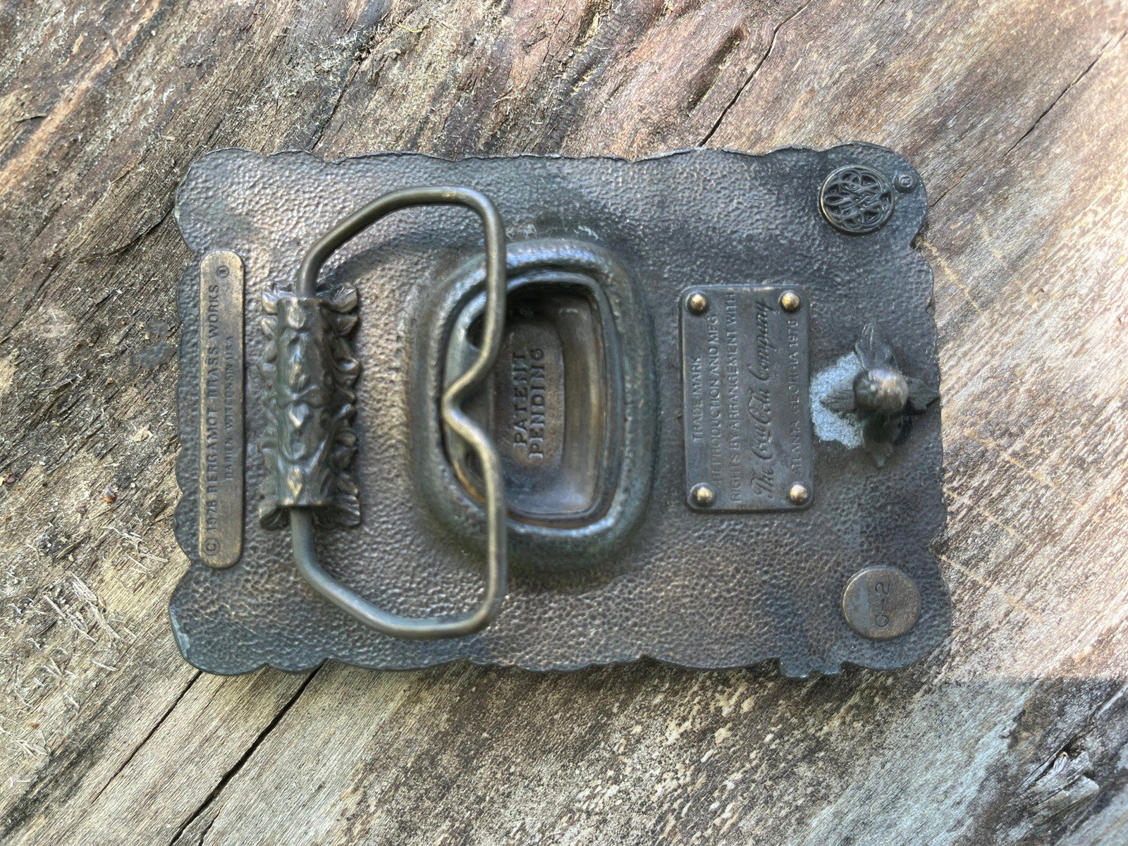 1977 Coca Cola belt buckle with bottle opener underside detail