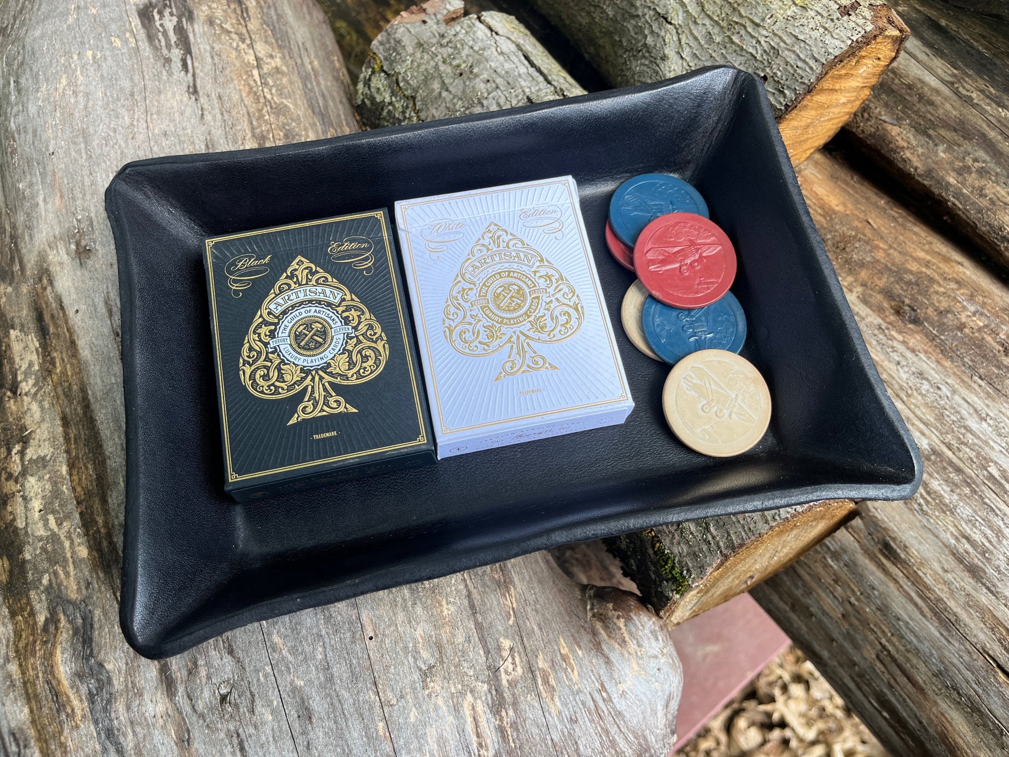 Black leather valet tray shown with vintage poker chips and black and white artisan card decks