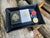 Black leather valet tray shown with vintage poker chips and black and white artisan card decks