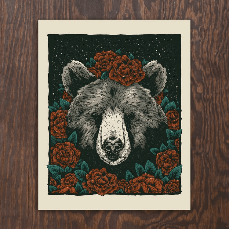 Black bear silkscreened print by Logan Schmitt shown against woodgrain background