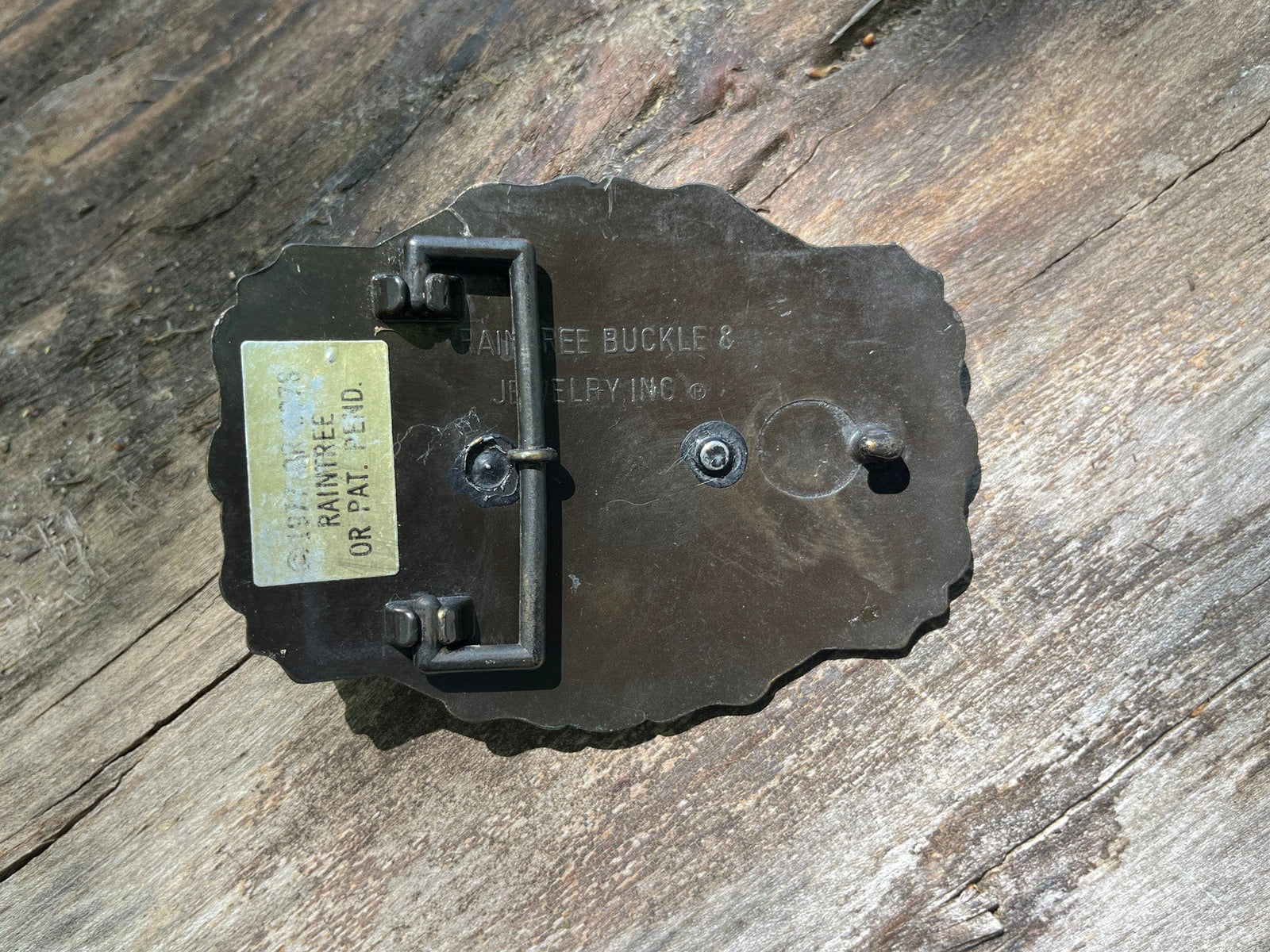 Underside detail of vintage Raintree bluegill belt buckle