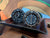 Seiko Mai alarm clocks shown on desk in black and metallic and black 