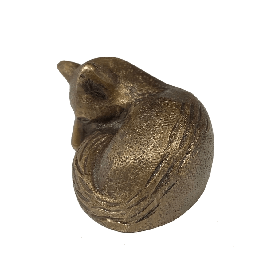 Side detail of small brass sleeping fox