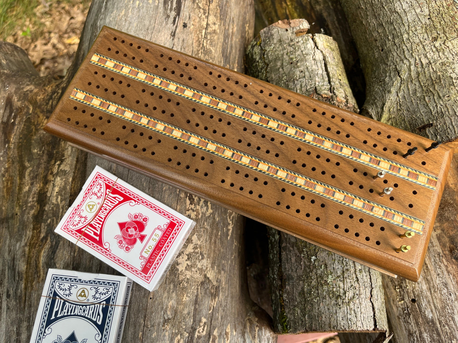Solid walnut deluxe three track cribbage set shown displayed with cards