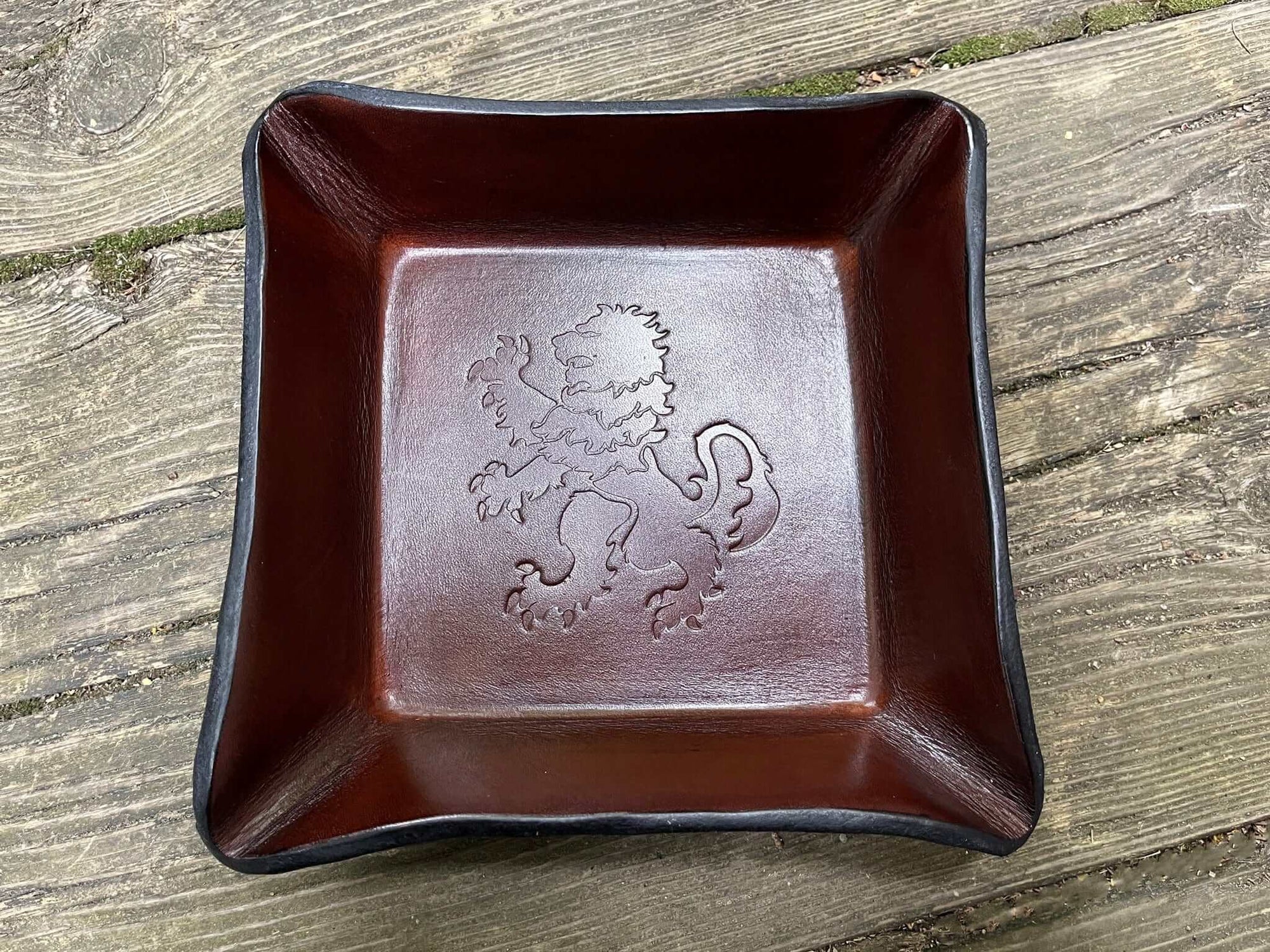 Brown leather valet tray with heraldic rampant lion. Square
