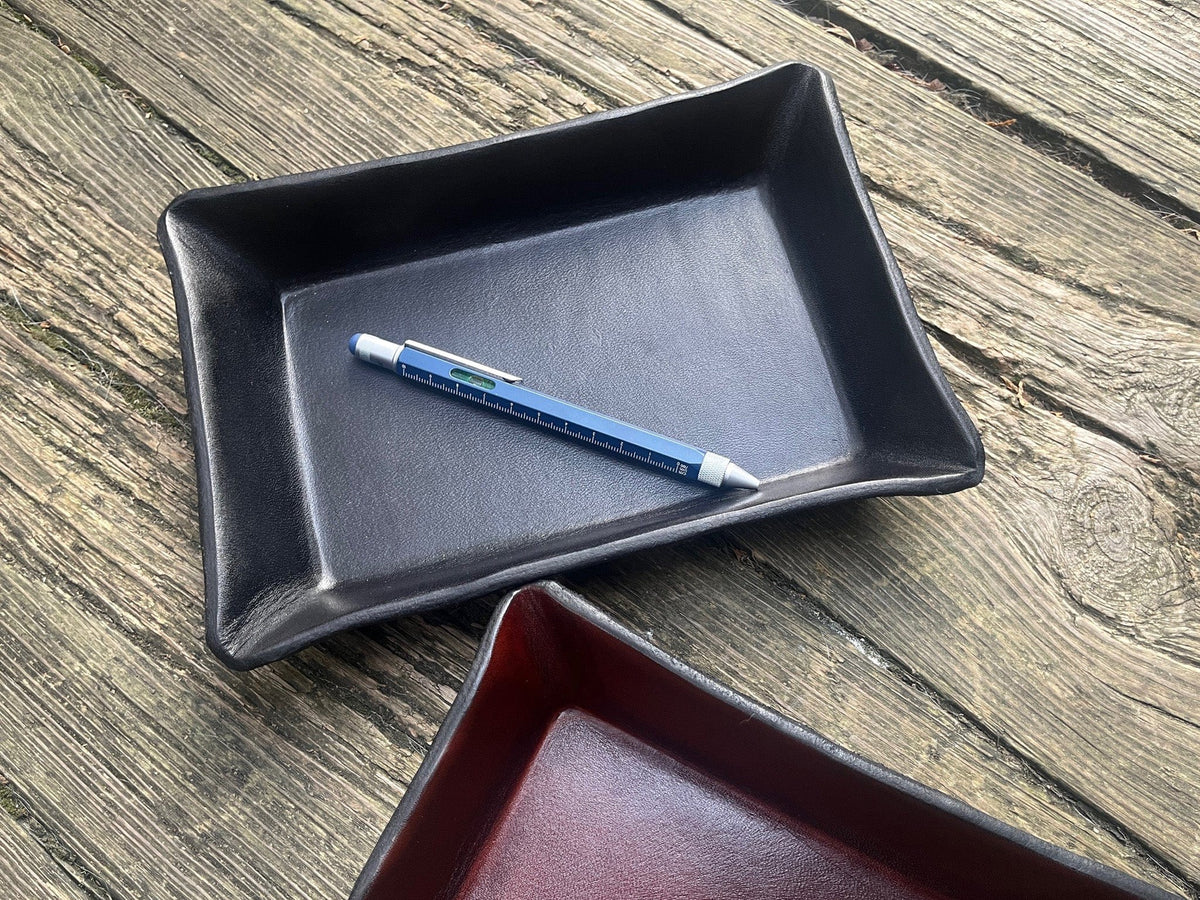 Troika blue construction pen shown inside black leather tray