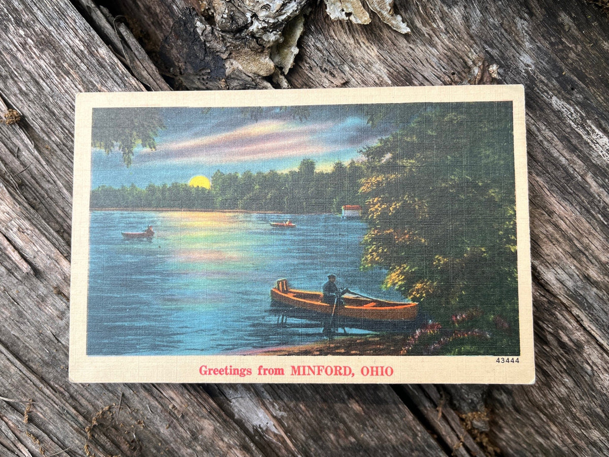 1920&#39;s vintage NYCE manufacturing postcard with canoes on a lake. Front.