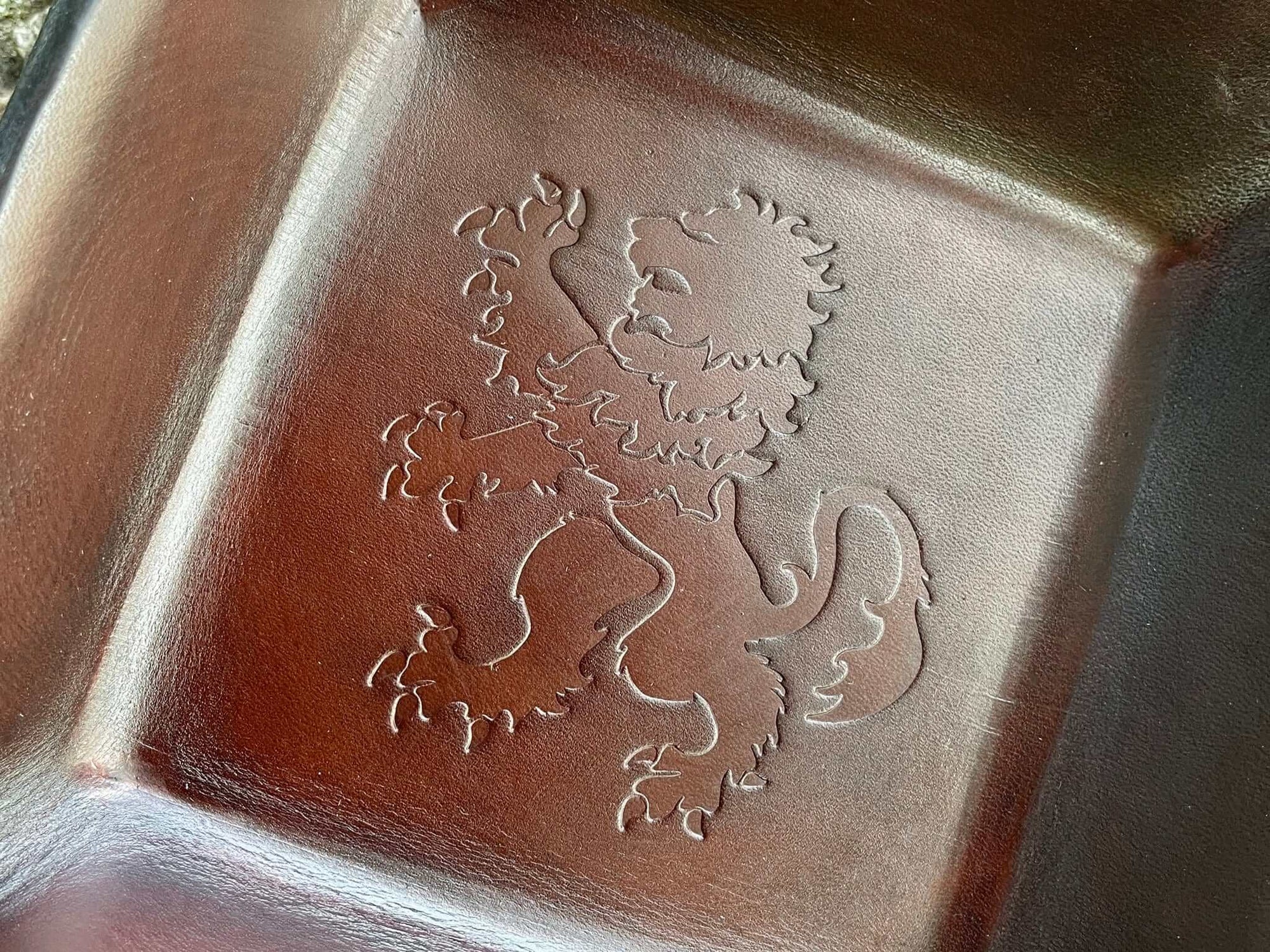 Detail of square rampant lion leather tray