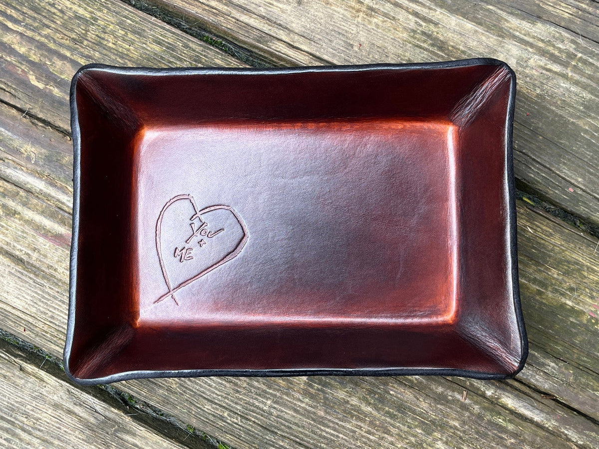 Timber brown leather valet tray with embossed heart that says &quot;you + me&quot;