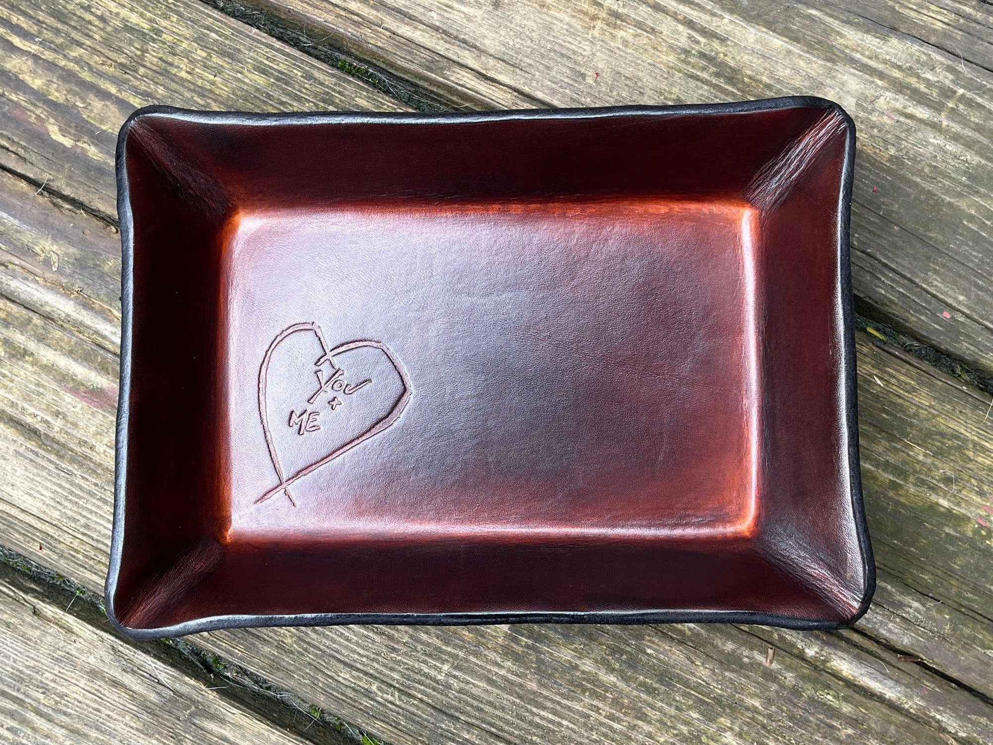 Timber brown leather valet tray with embossed heart that says "you + me"
