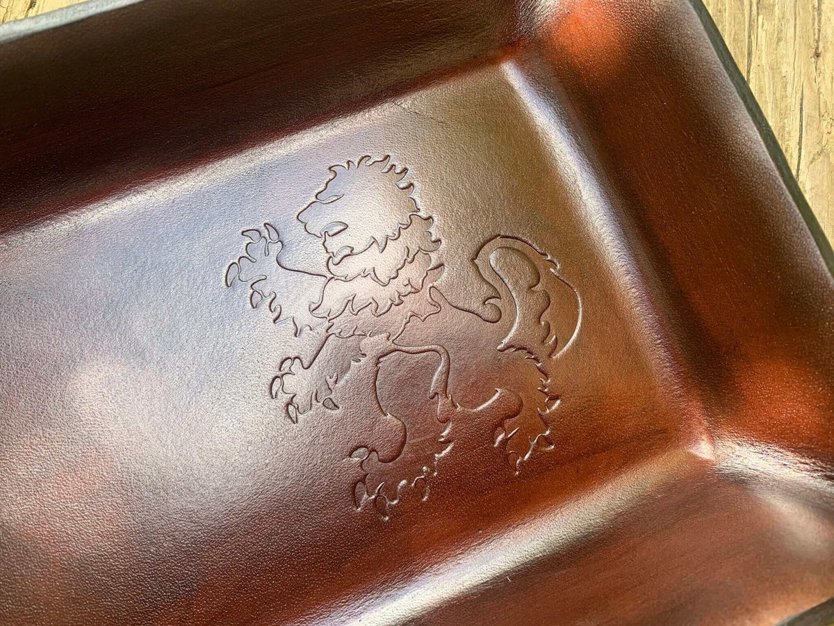 Detail of rampant lion leather valet.  Dark Brown