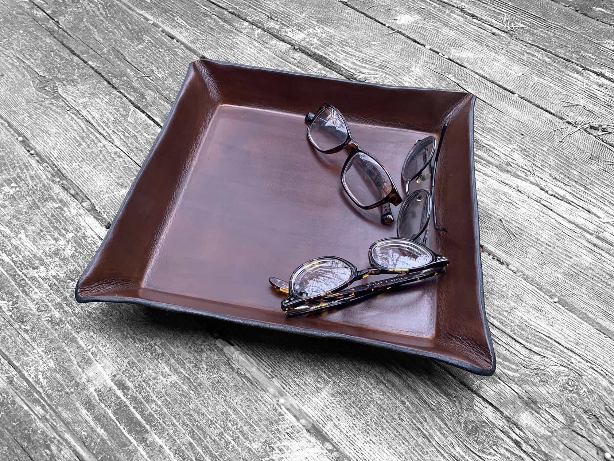 Large, square leather valet tray. 