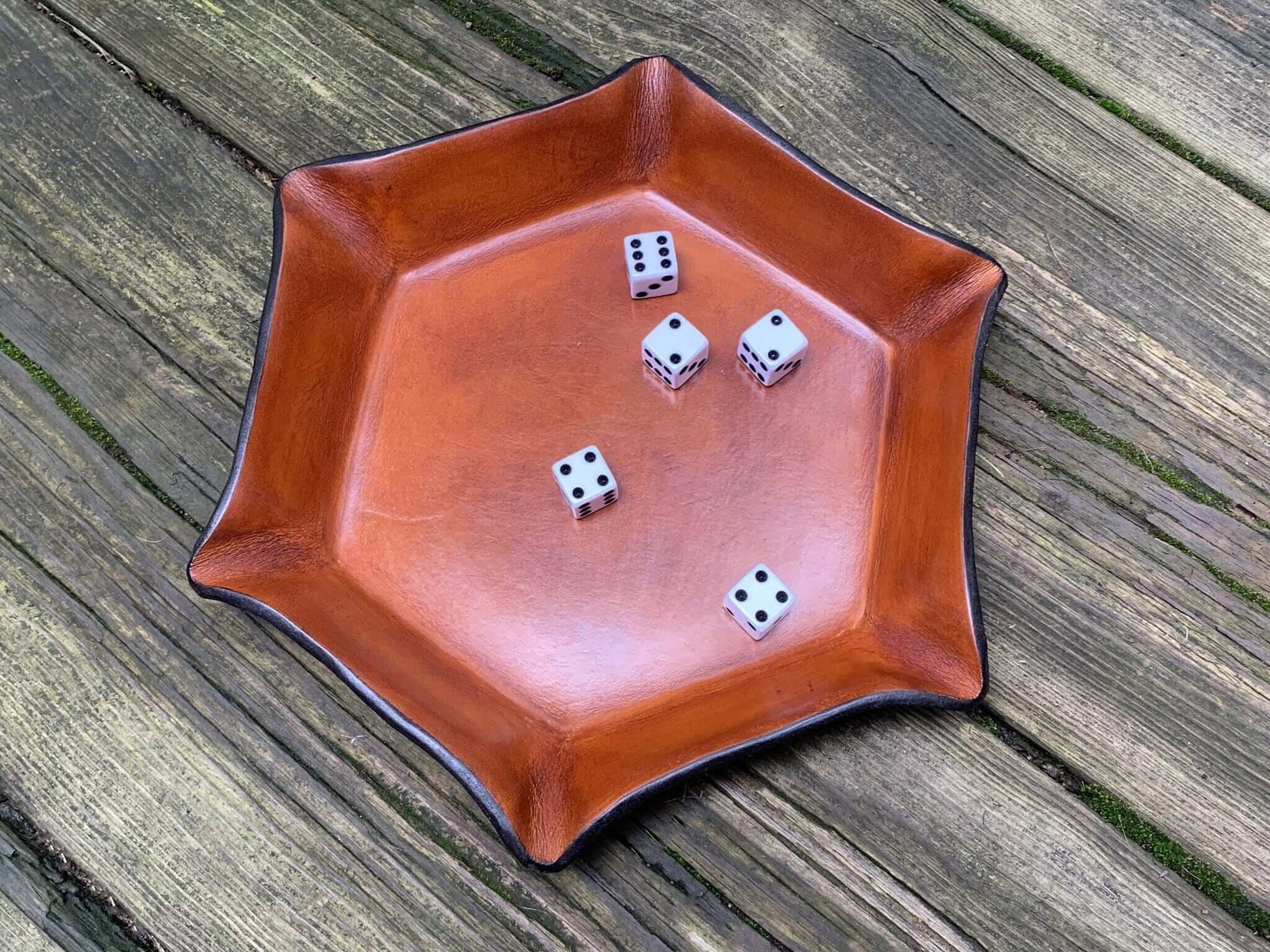 Leather tray for fantasy dice game.