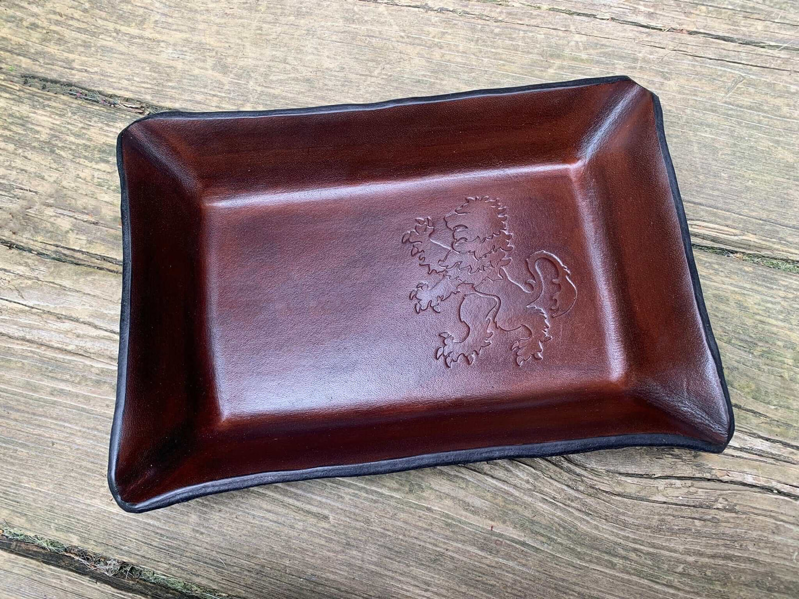 Brown leather valet with heraldic lion image