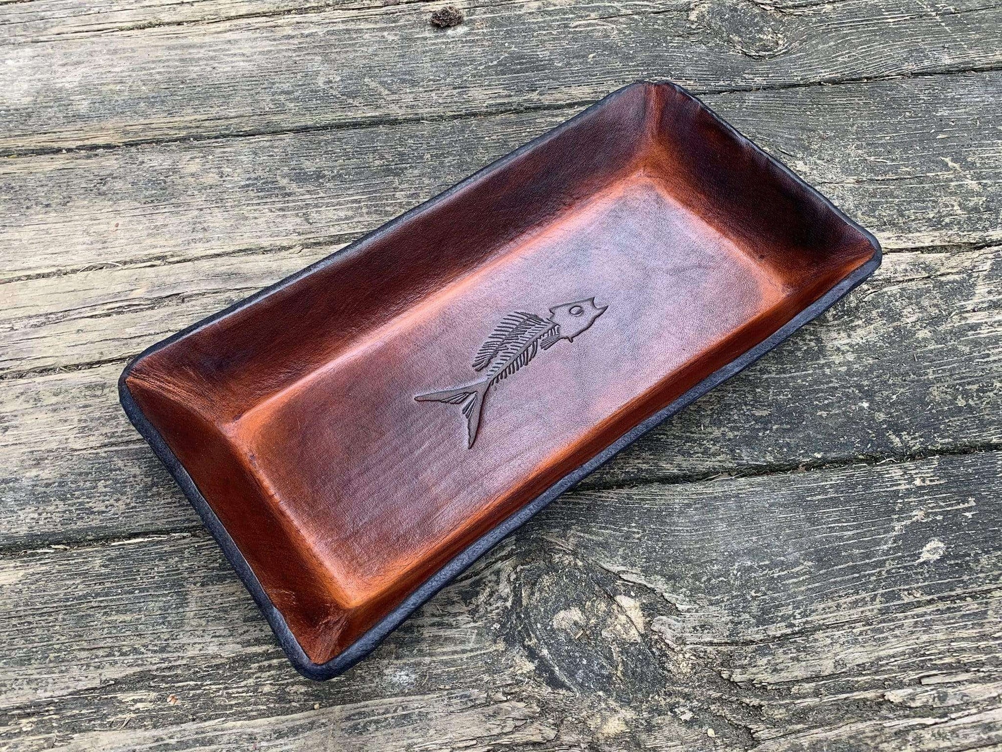 Timber brown leather valet tray with fossil fish image. 