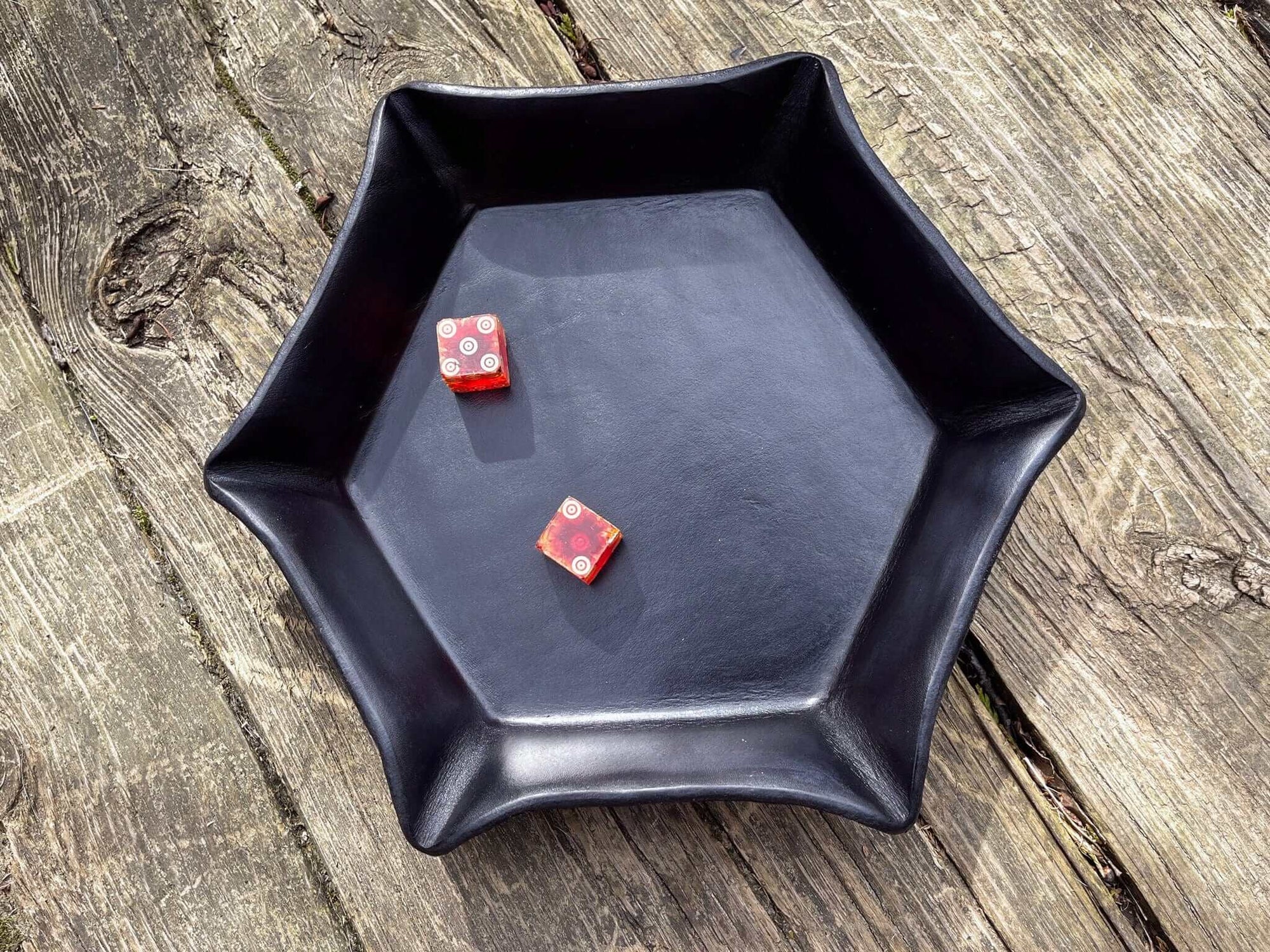 Black leather tray for dice. Hexagon shape