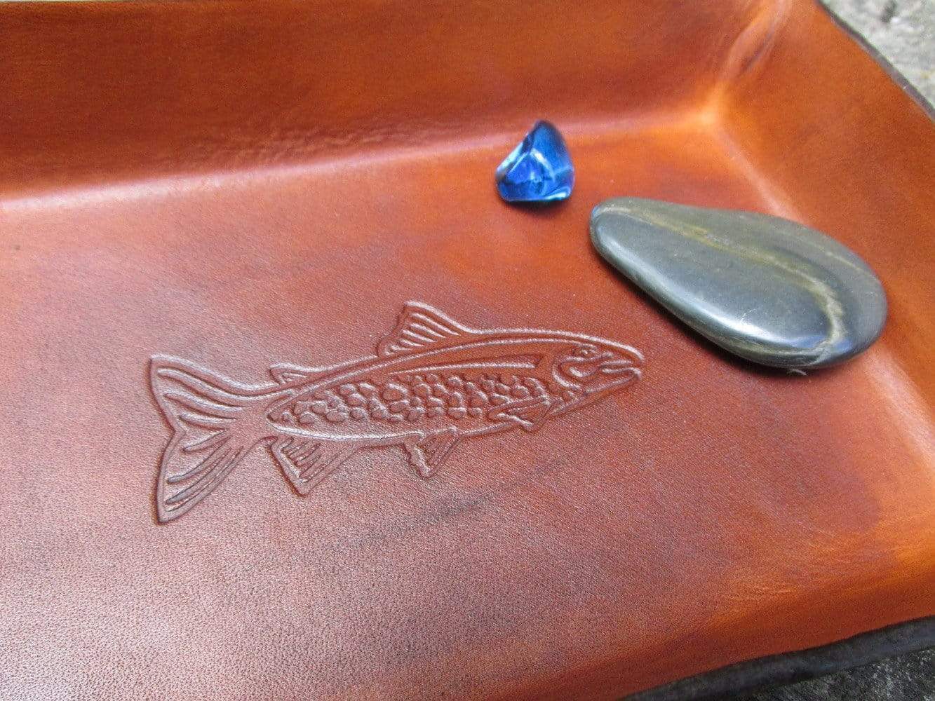 Trout image leather desk tray. Detail. 
