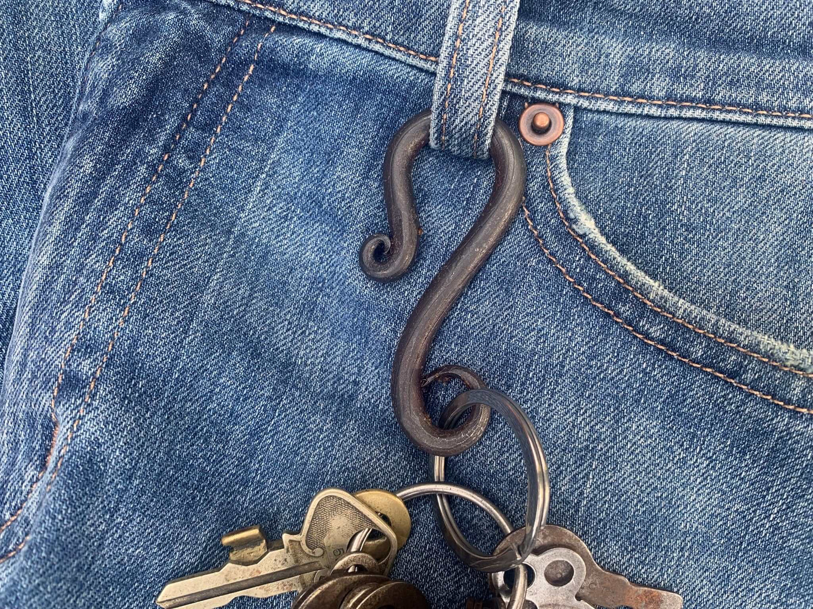 Detail of iron key ring for belt loop. Twin Saints Leather