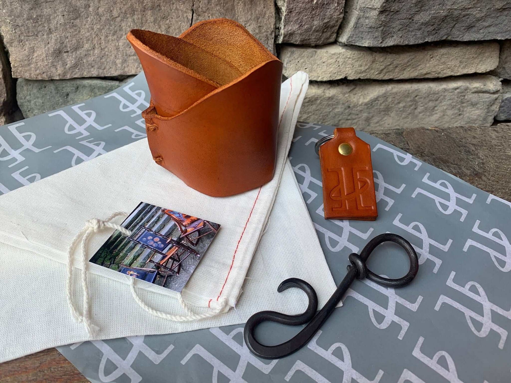 Leather cup and bottle opener set.  Tan