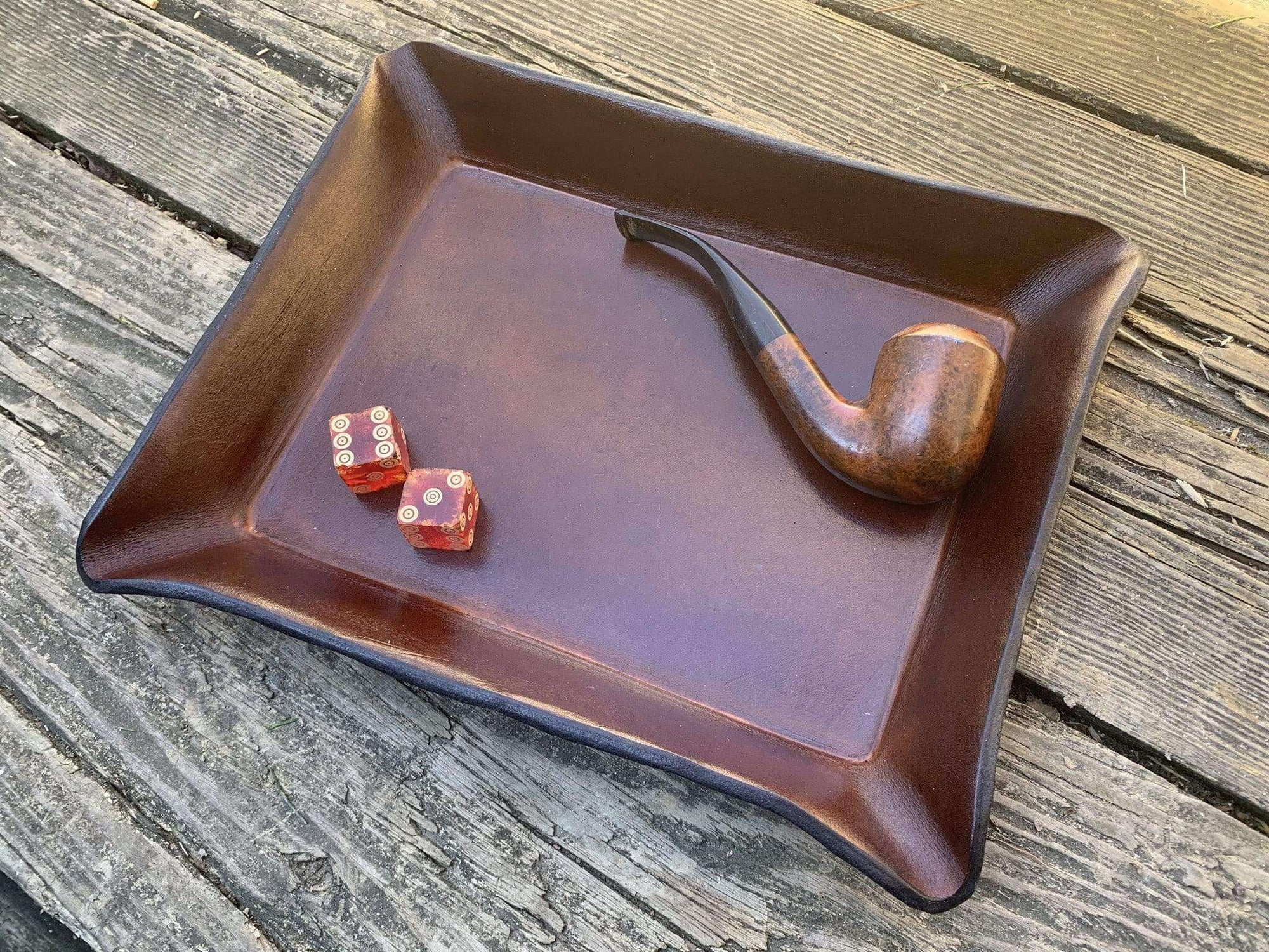 Leather valet tray for pipe display.