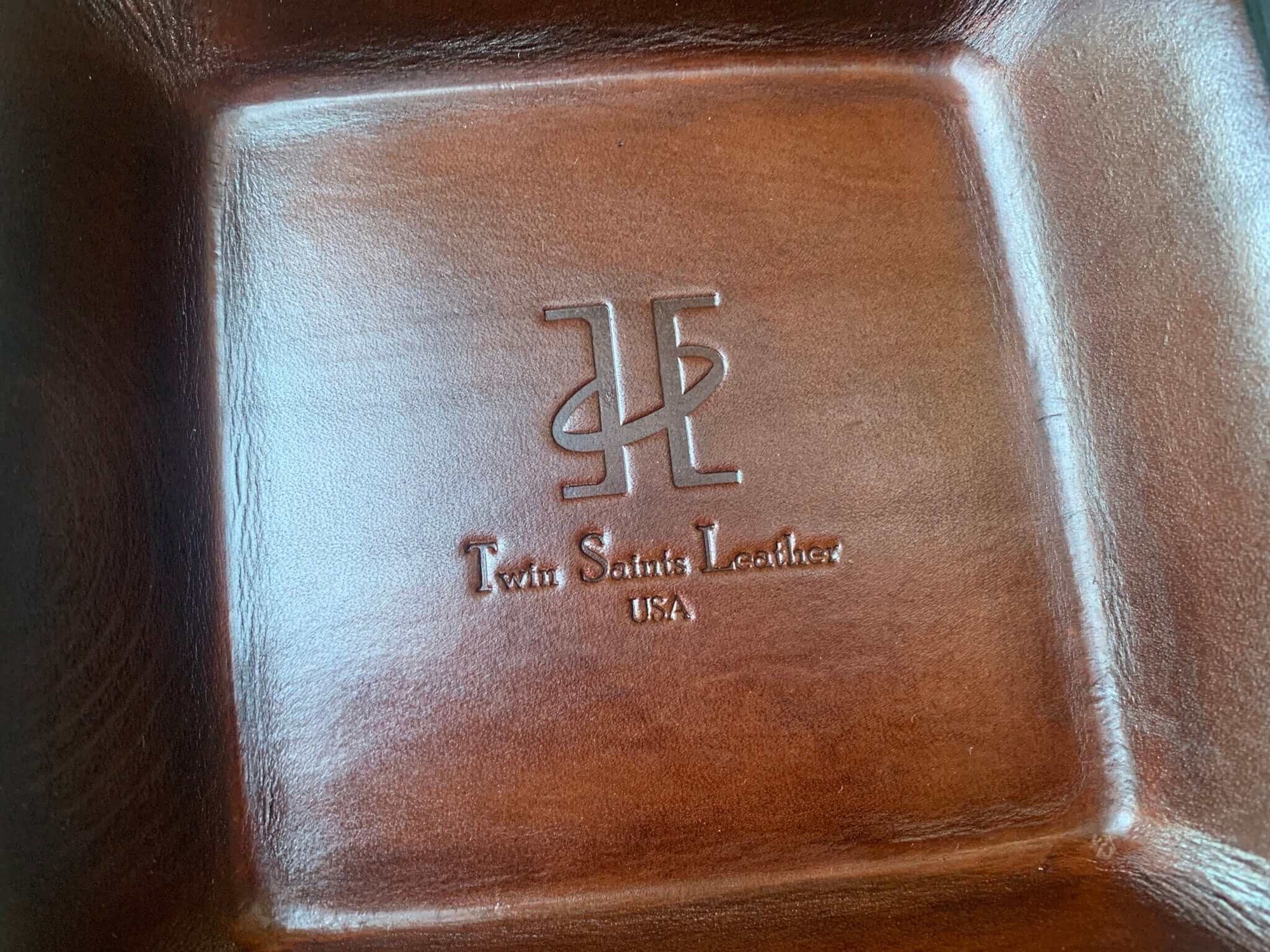 Detail of Twin Saints Leather logo tray