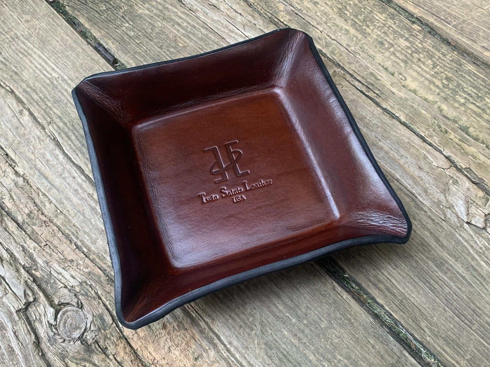 Brown leather tray with logo