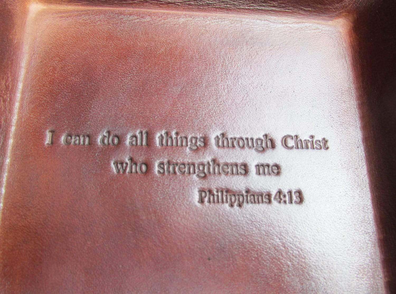 Leather tray with bible verse.  Philippians. Detail.